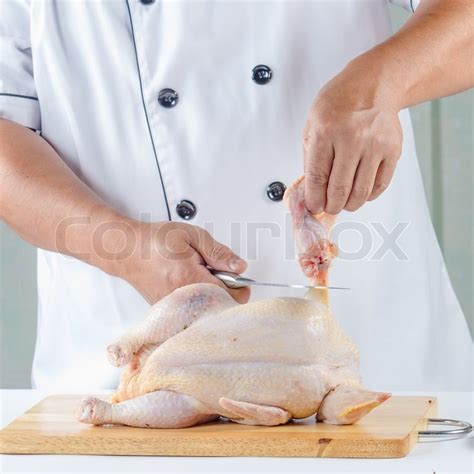 Explanation Between the tasks of cubing raw chicken and slicing croissants, a food worker must clean and sanitize a cutting board. . A food worker has finished cutting raw chicken